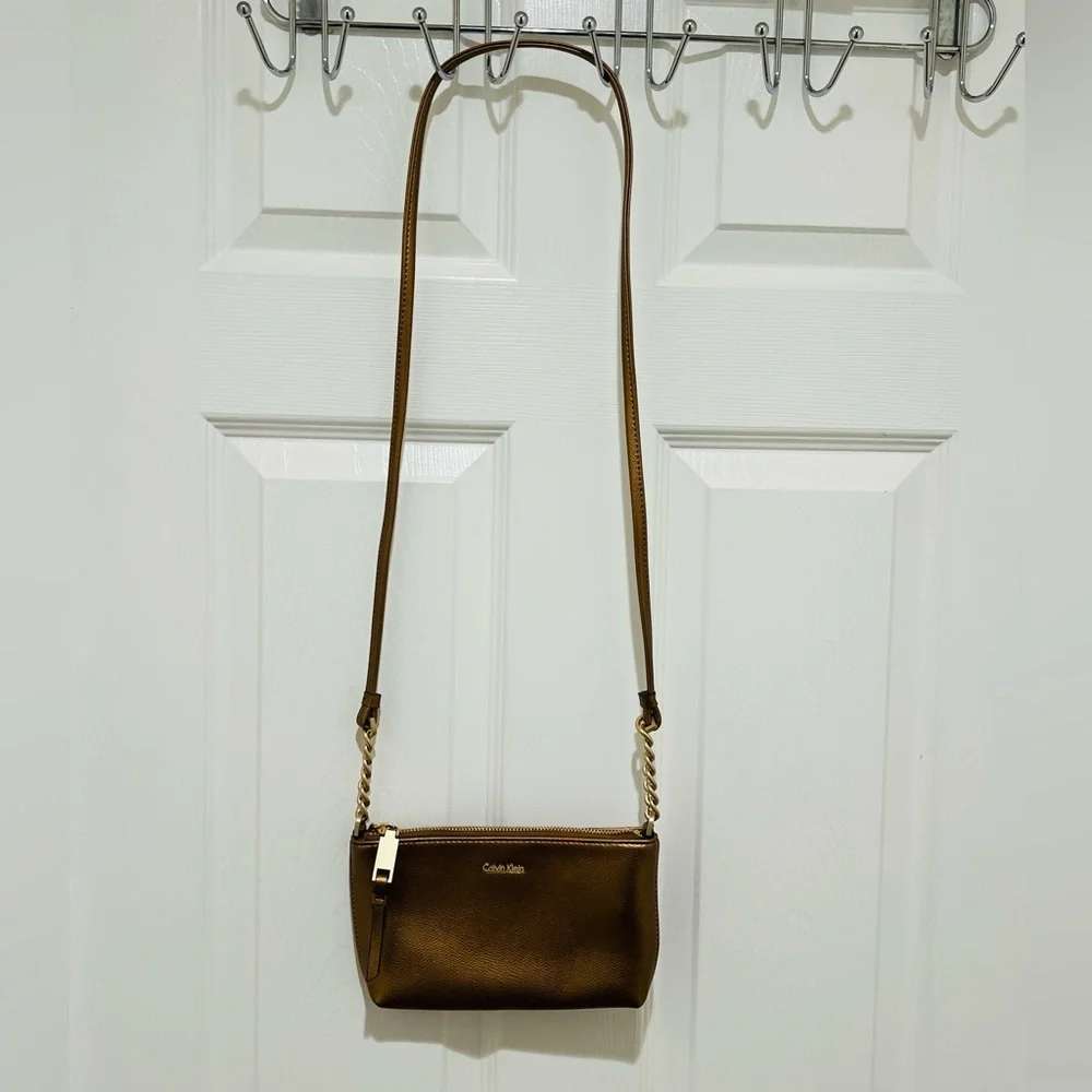 Calvin Klein Crossbody Bag in a bronze color featuring gold-toned hardware - Picture 2 of 5